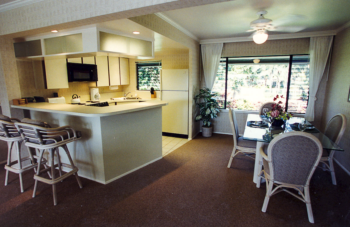 A spacious kitchen and dining room area at VRI's Alii Kai Resort in Hawaii